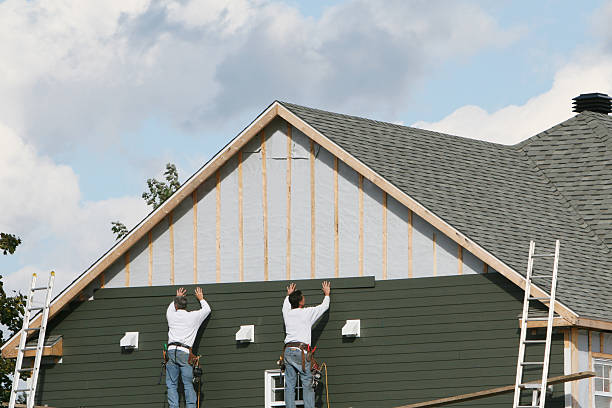 Professional Siding technician working in Brookville, IN